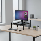 Computer setup on a desk with a monitor, keyboard, and mouse in a modern office setting.