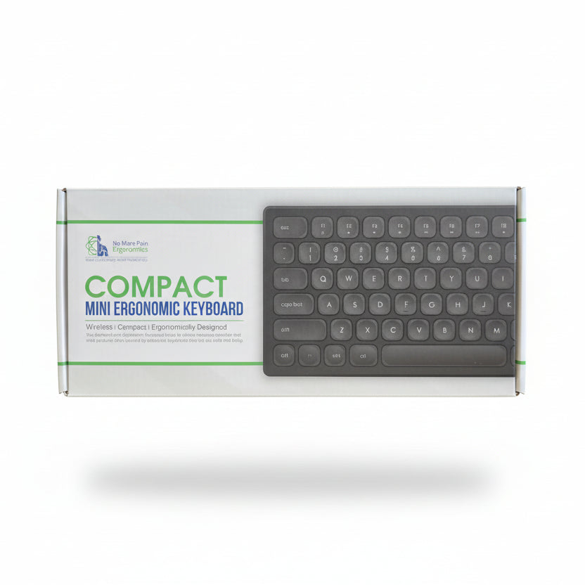 Compact mini ergonomic keyboard packaging on a cardboard box with a staircase in the background.