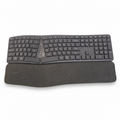 An ergonomic split keyboard with integrated wrist rest and adjustable feet, primarily in black color.