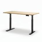 Adjustable height desk with black legs and a light wood top on a white background
