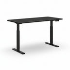 An electric height-adjustable standing desk with a black tabletop and black frame, featuring a digital control panel and rubber foot pads.
