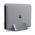 A gray vertical laptop stand with dual adjustable bays, designed to hold a laptop and tablet in clamshell mode.